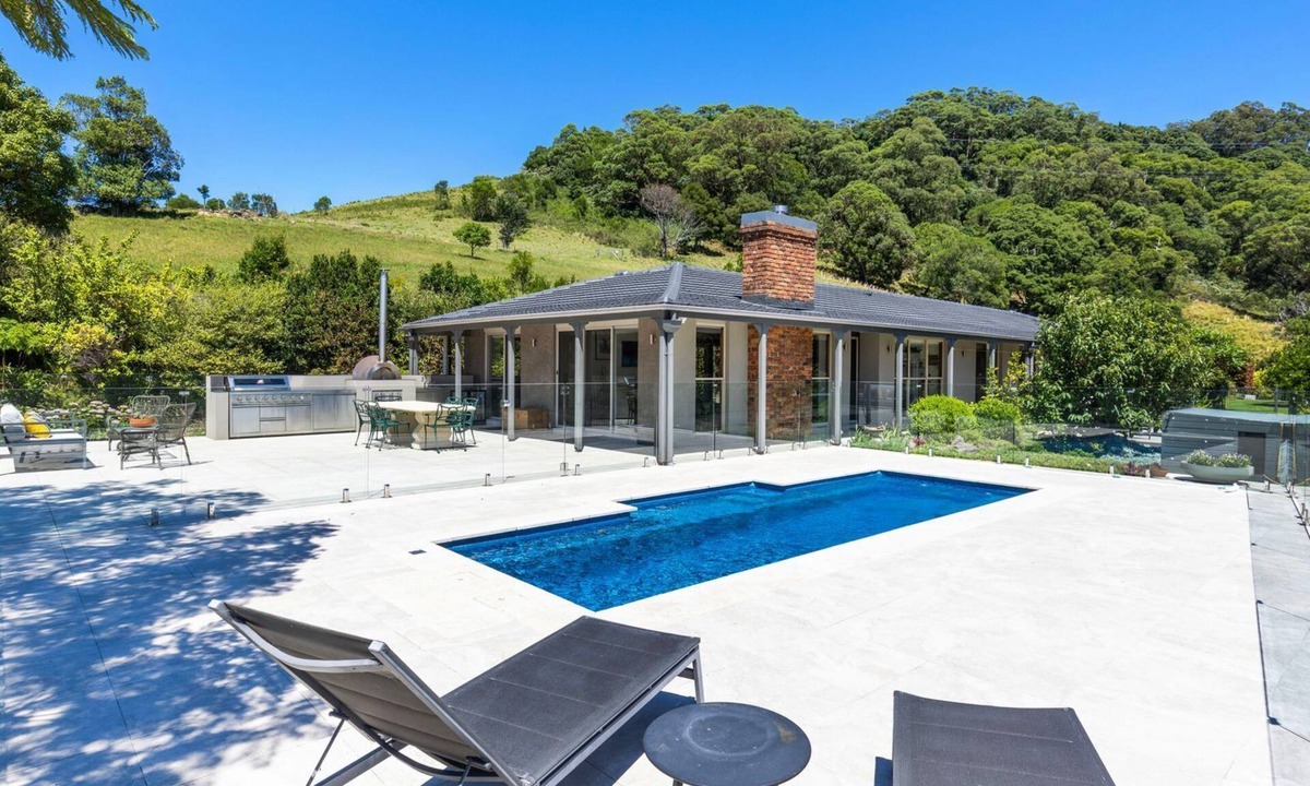 Broughton Village House | Moonraker - Fireplace with Swimming Pool
