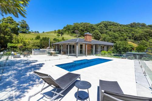 Broughton Village House | Moonraker - Fireplace with Swimming Pool