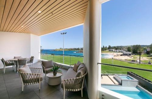 Kiama Apartment | 3BR Coastal Escape with Ocean Views, Shared Pool & Jacuzzi, 2 Car Spaces & Walk to Surf Beach