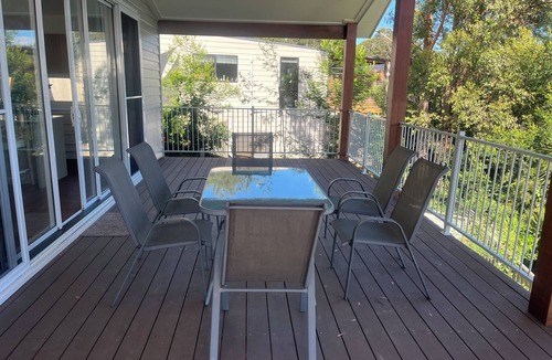 Long Beach House | Coastal Retreat at Long Beach - golden sunset on the deck
