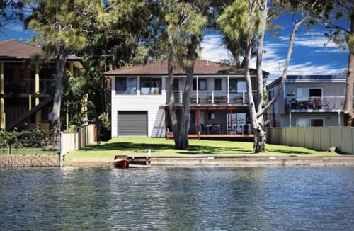 Gorokan House | Family-sized Waterfront Home with lake views & private jetty!