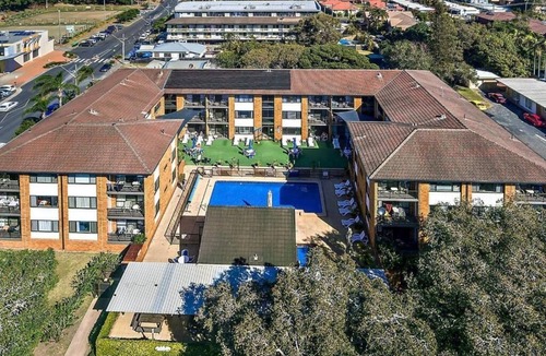 Coffs Harbour Apartment | Ground floor quiet garden balcony heated pool @223