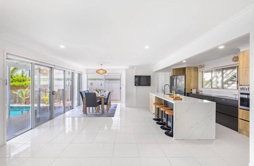 Runaway Bay House | Harborview Bliss: 4BR Coastal Retreat w/Pool