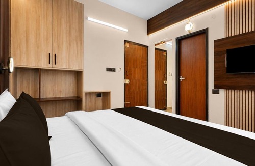 Palm Meadows Hotel | Hotel O Teja Luxe Suites