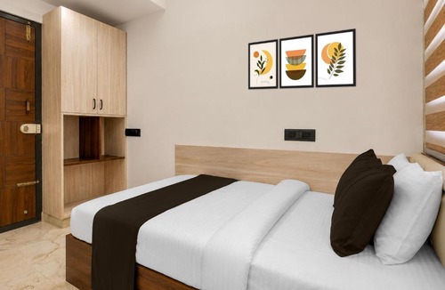 Palm Meadows Hotel | Hotel O Teja Luxe Suites