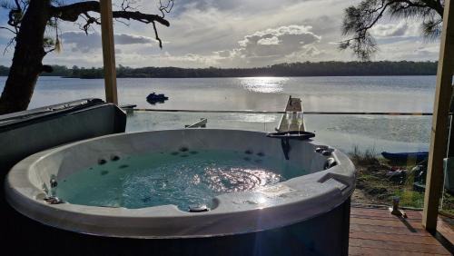 Erowal Bay House | Jerrinja - Absolute waterfront with jetty - 5 mins to Hyams Beach