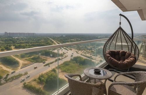 Gurugram Apartment | Lush Comfort Studio with Balcony Views
