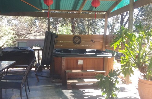 Spring Gully House | mount charmal cottage. 5 person spa under pergola. Large combination heater.