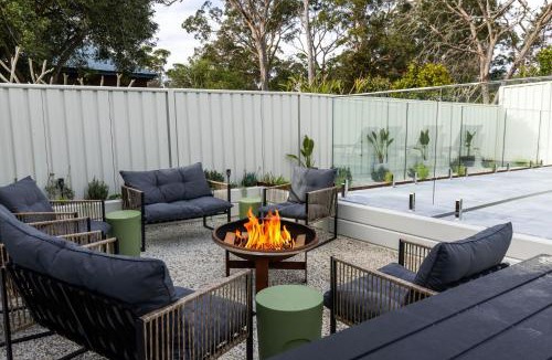 Callala Bay House | Samphire House - Fireplace with Heated Swimming Pool