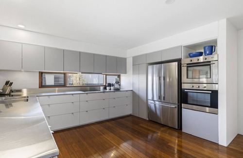 Emerald Beach Apartment | Victoria's Ocean Escape - Breathtaking Views, Shared Pool and Yard, Steps from Beach