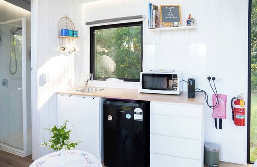 Maleny House | White Jacaranda Tiny House by Tiny Away