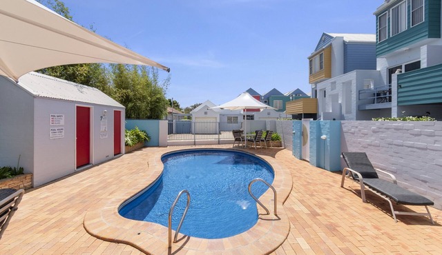 2-Bed Coastal Haven: River Views, Swimming Pool