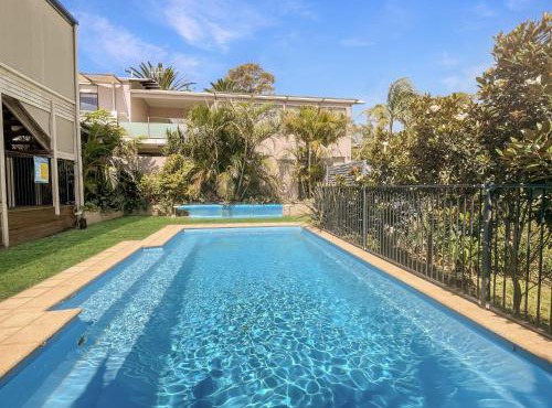 Coastal Upper-Level Home with Shared Pool Access