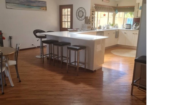 Open plan large home with outdoor patio and kitchen area