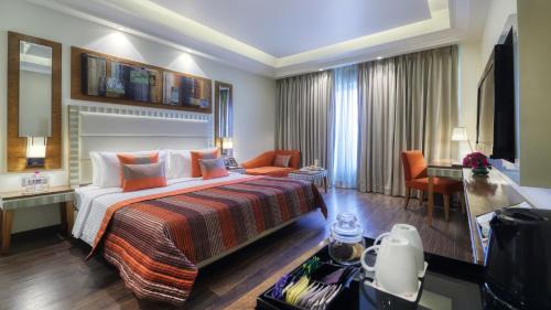 Premium Queen Room - Non-Smoking with 15 % OFF ON FOOD & Soft beverages/15% off on Laundry services//1+1 happy hours at Kokkinos from 6-8 pm on IMFL drinks// INR 500 SPA discount