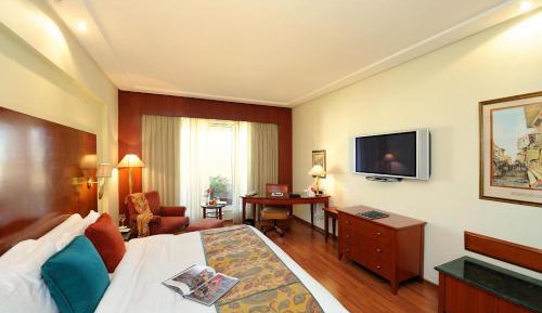 Lalit Luxury Suite, King Bed with Complimentary One way Airport Transfers , 15% off on session on Spa and Enjoy Happy Hours with 1+1 offer on Beverages